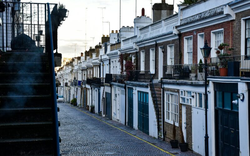 a row of houses on a cobblestone street