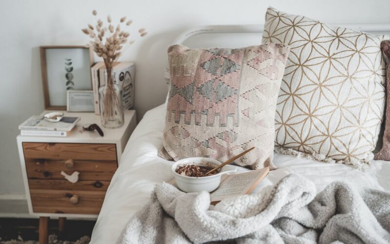 A Bowl of Breakfast in Bed over a Book