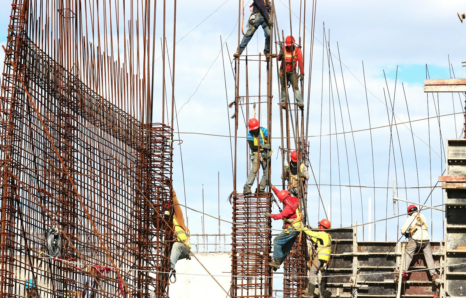 people working on building during daytime