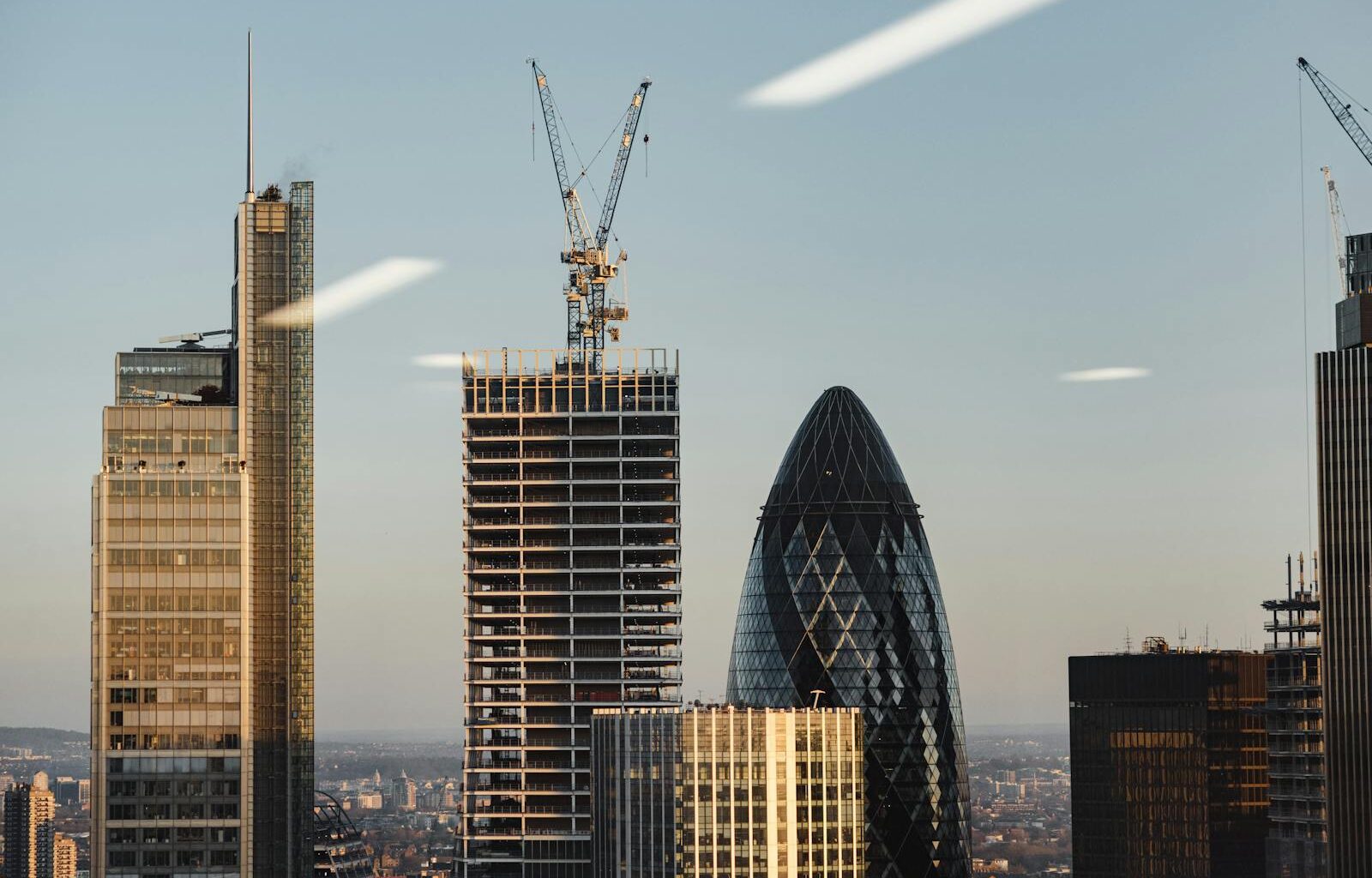 Through window of modern buildings under constructions