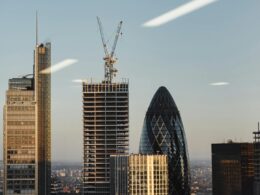 Through window of modern buildings under constructions