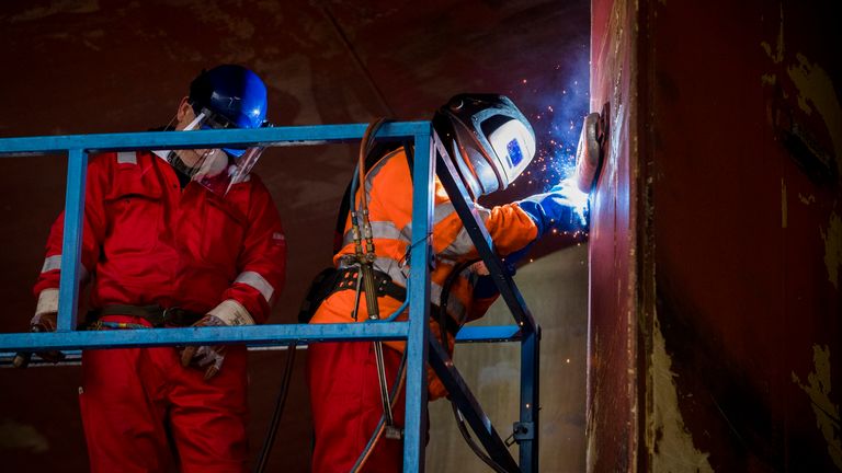 A worker at Harland and Wolff MIG welds an anode onto the rudder as workers at Harland and Wolff in Belfast begin work on the first ship to go through refit at the yard since the takeover by London-based energy company InfraStrata stepped in with a ??6m rescue deal that saved from yard from closure.