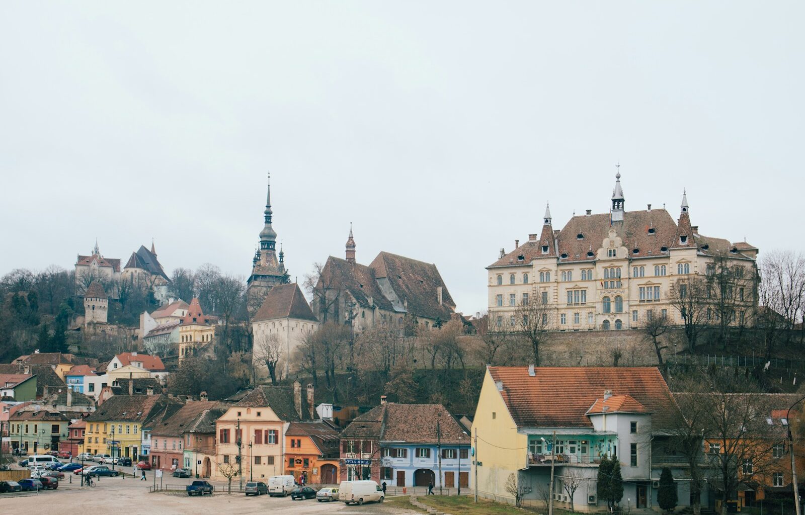 beige and brown gothic building on hill