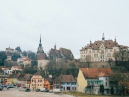 beige and brown gothic building on hill