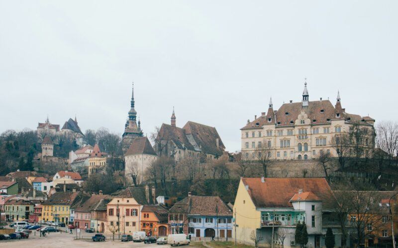 beige and brown gothic building on hill